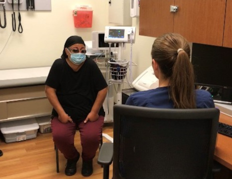 Patient sitting on examining room with a Brumback Clinics Nurse at St. Ann